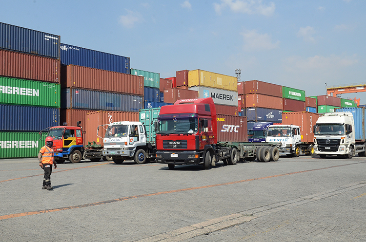 Container trucks inside the Manila International Container Terminal